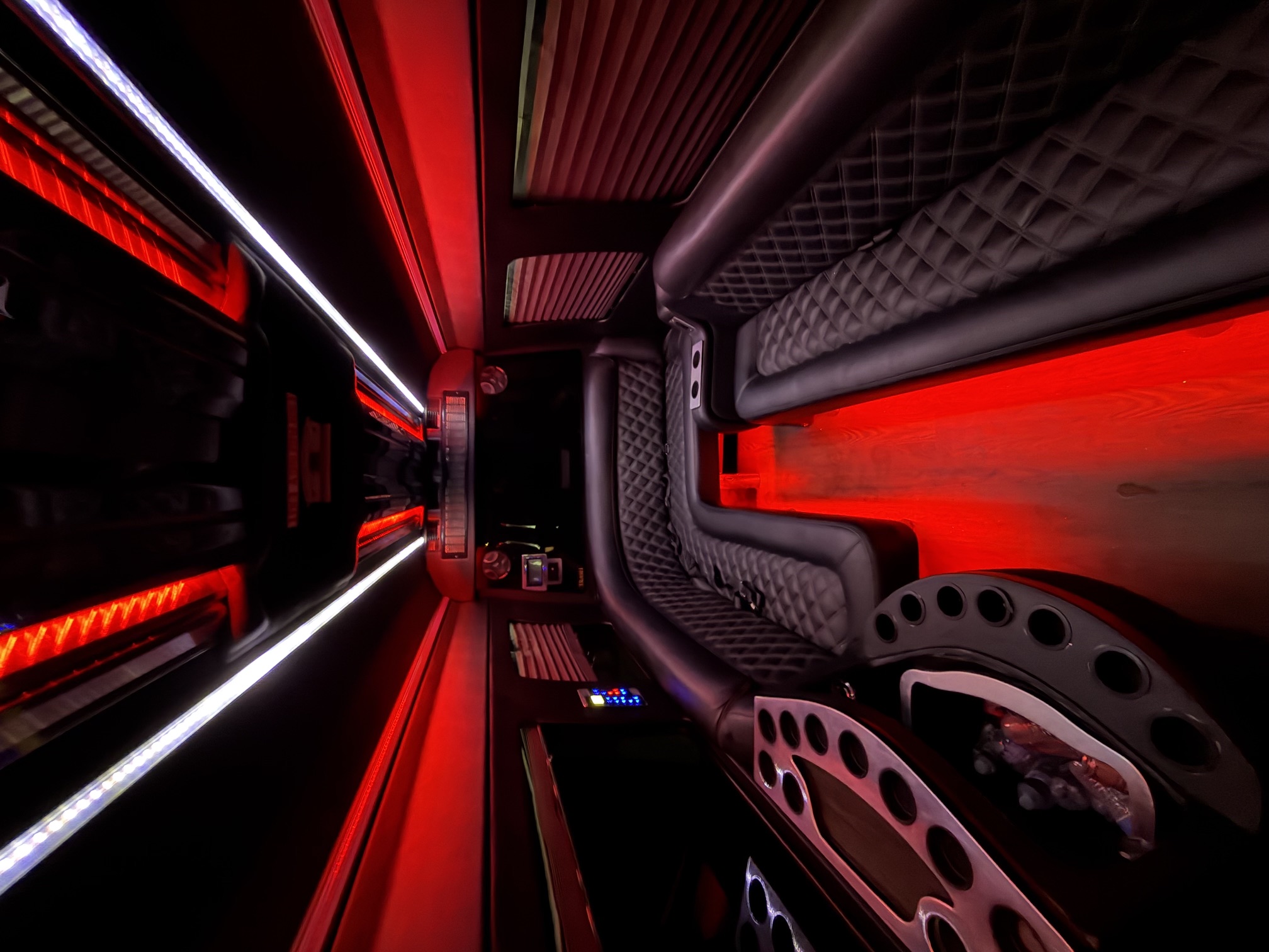 Party bus interior with red LED lighting